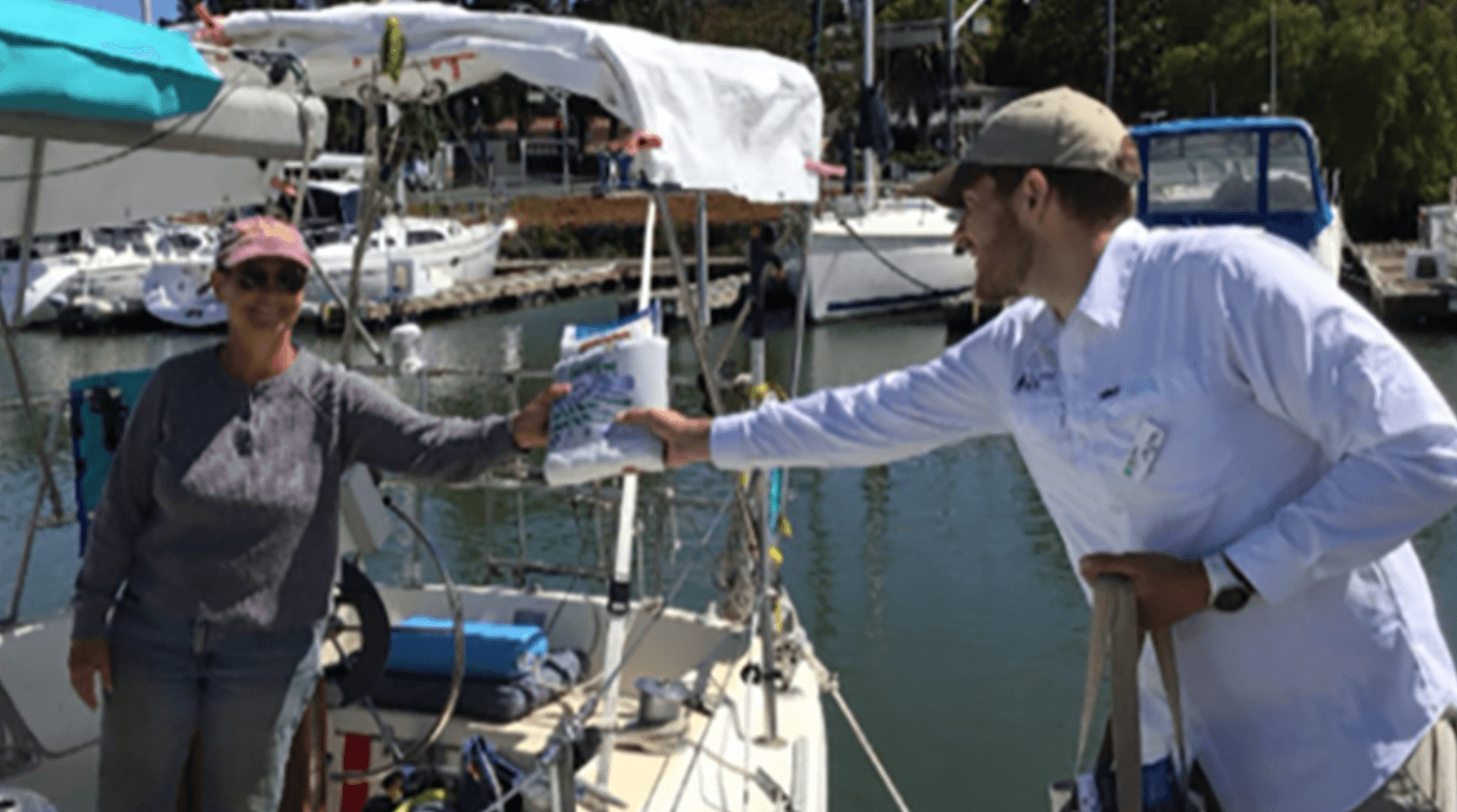 Dockwalker partner distributing a CA Boater Kit to a boater